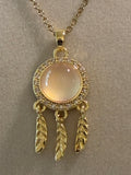 Stainless steel gold plated, dreamcatcher with moonstone and rhinestones, feather pendants