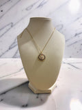 Gold plated circular evil eye pendant with zirconia stones