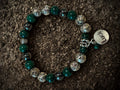 Greenstones and metal beads with luck charm