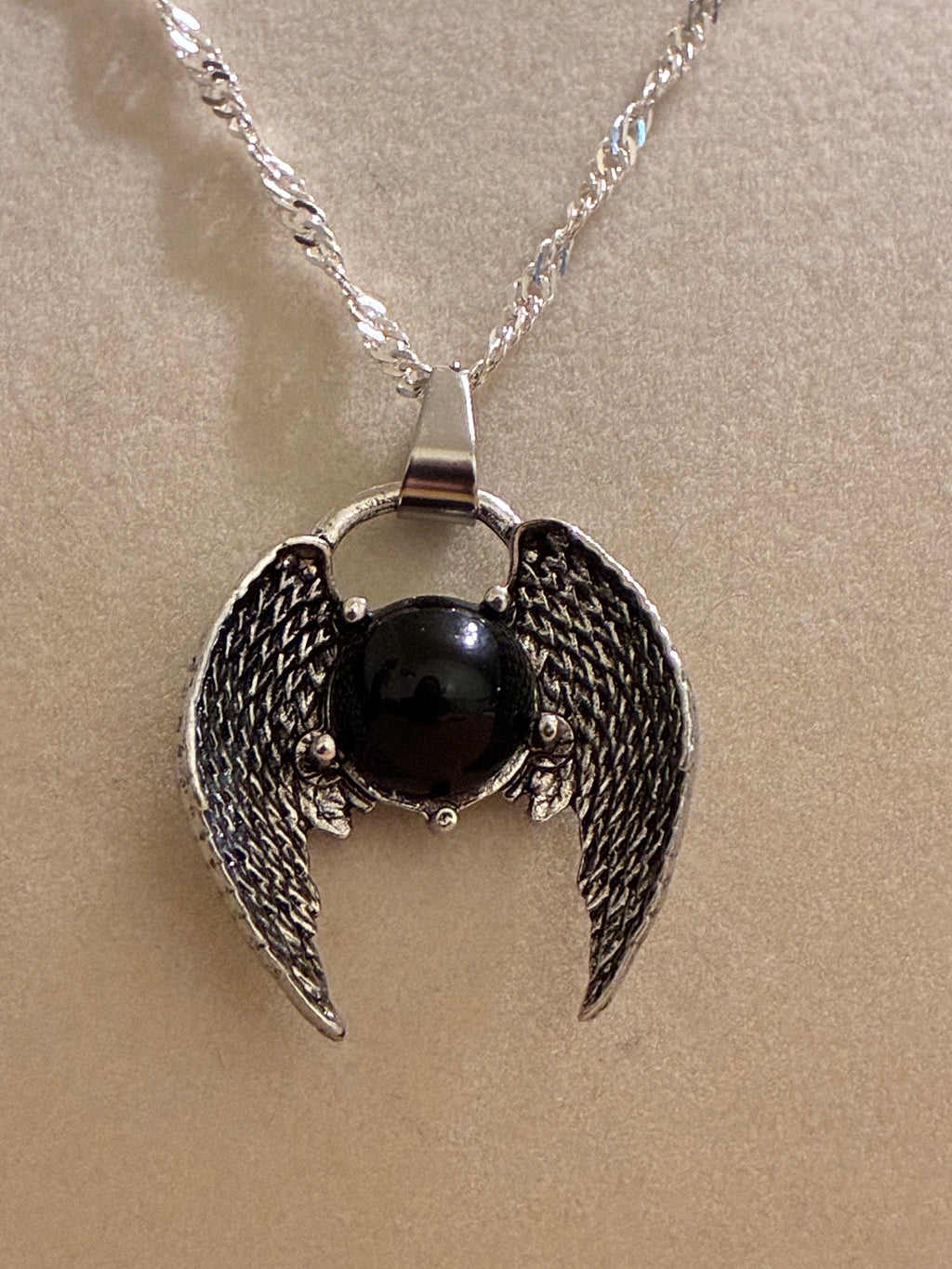 Silver plated black stone wings
