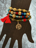 Set of 4 colorful beaded bracelets with charm and tassel ￼