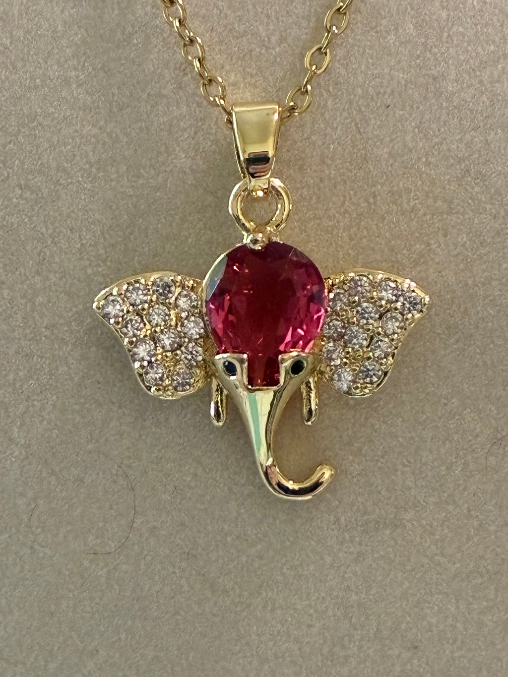 Stainless steel gold plated￼elephant with pink stone and rhinestones ￼