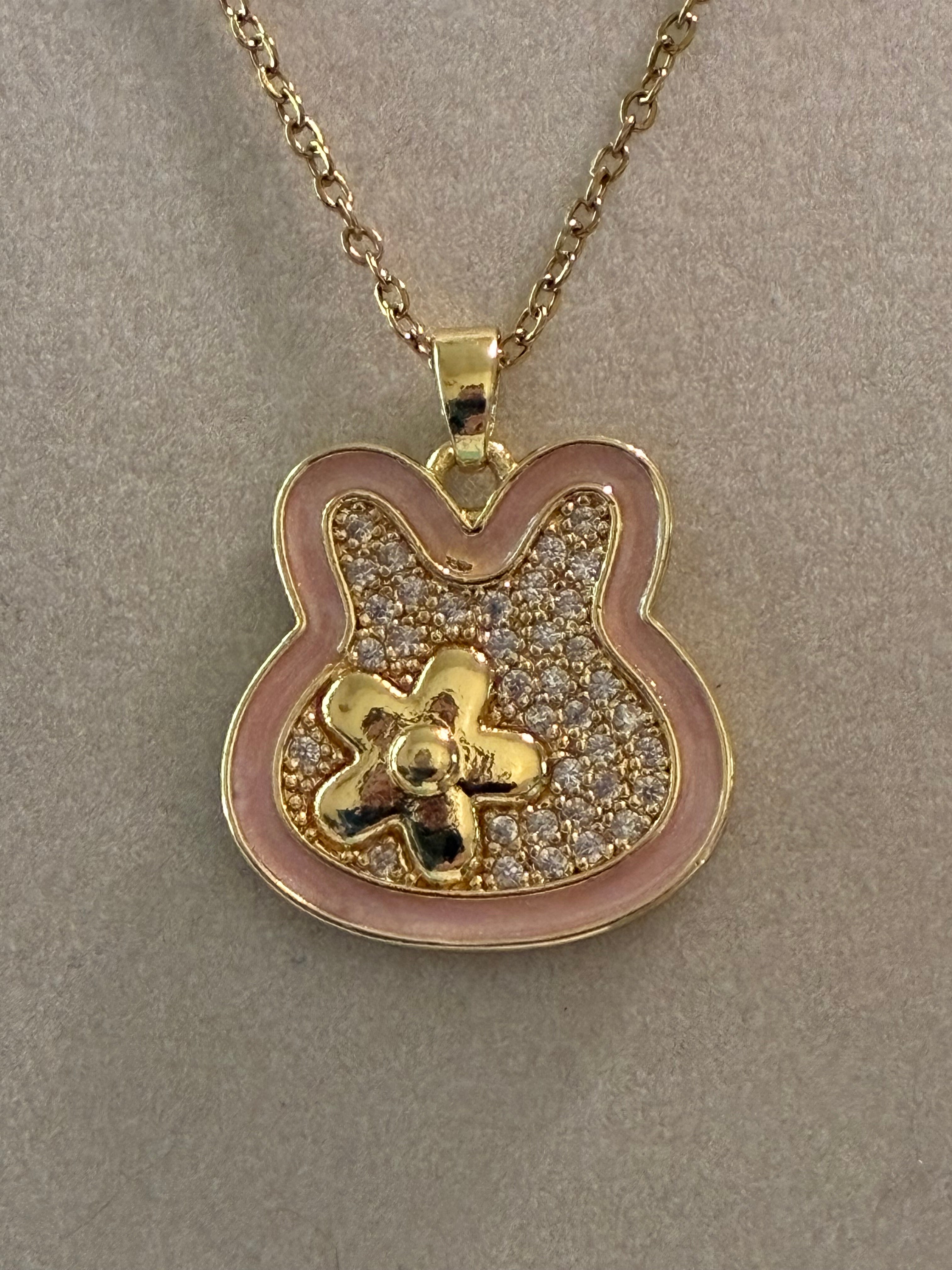 Stainless steel, gold plated, bunny pendant with flower and rhinestones ￼