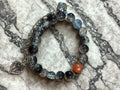 Dark galaxy bracelet with charms