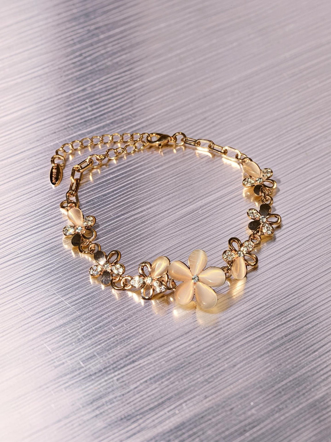 Gold plated, pink flowers with rhinestones