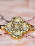 Gold plated, opal flower with rhinestones
