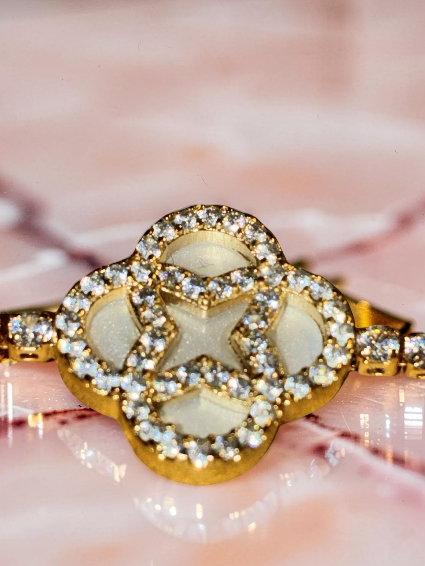 Gold plated, opal flower with rhinestones