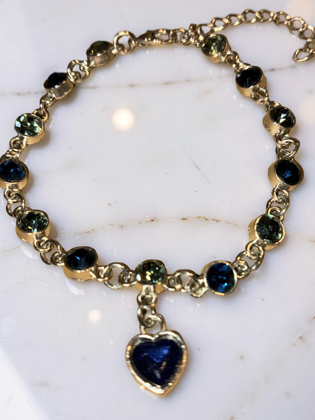 Silver plated heart, blue and green rhinestones ￼