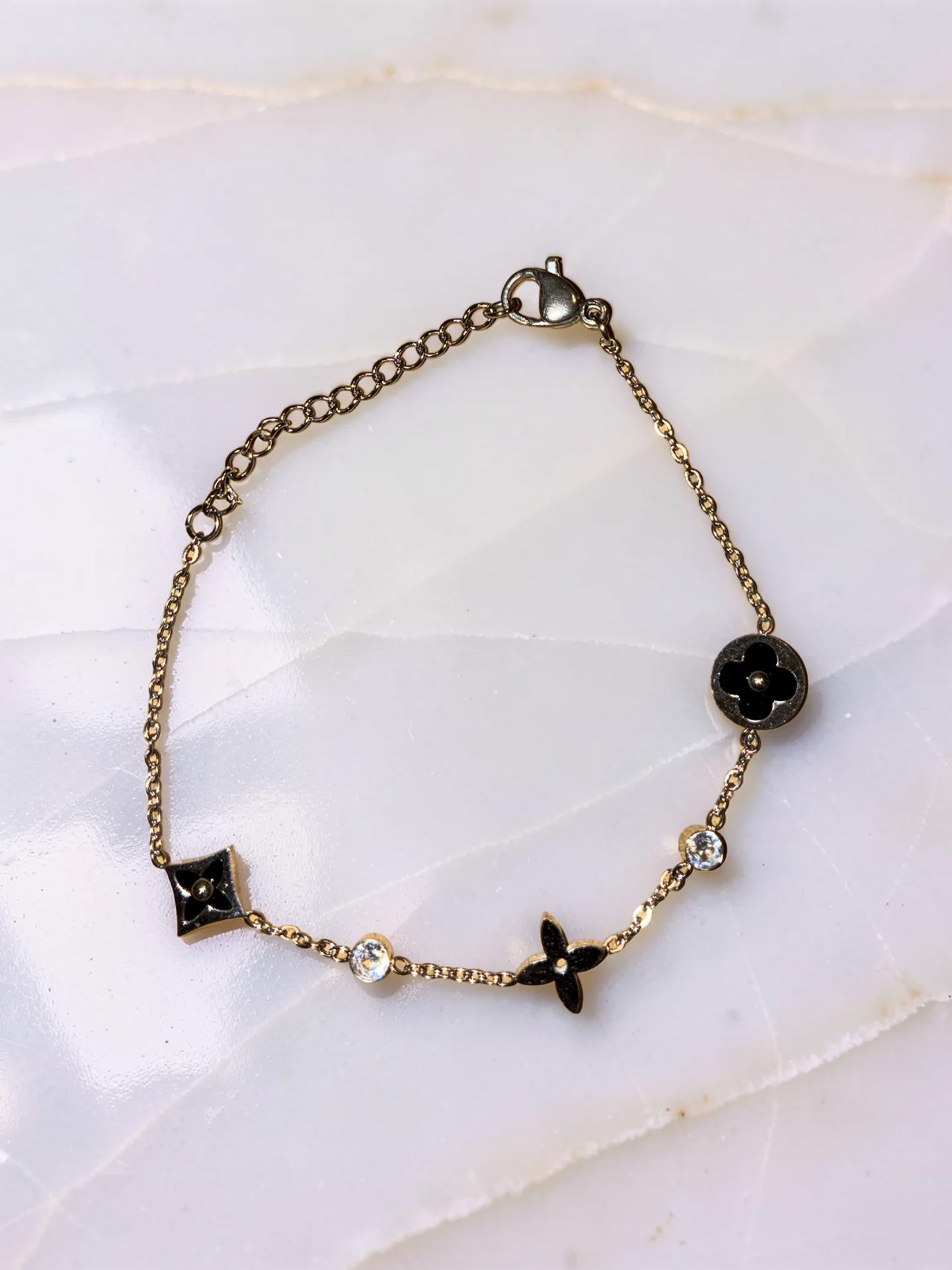 Gold plated, flowers, and rhinestones, dainty