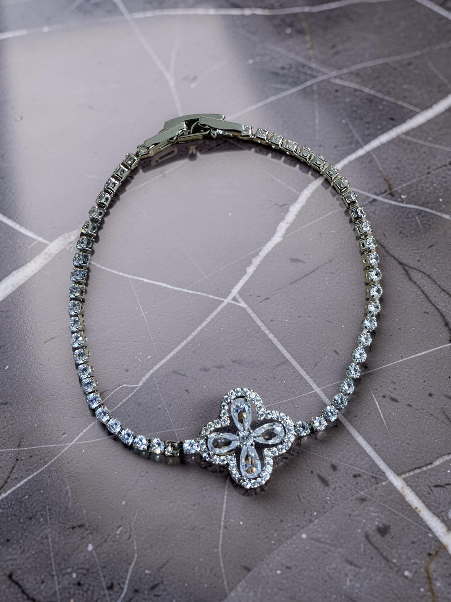 Silver plated flower with rhinestones