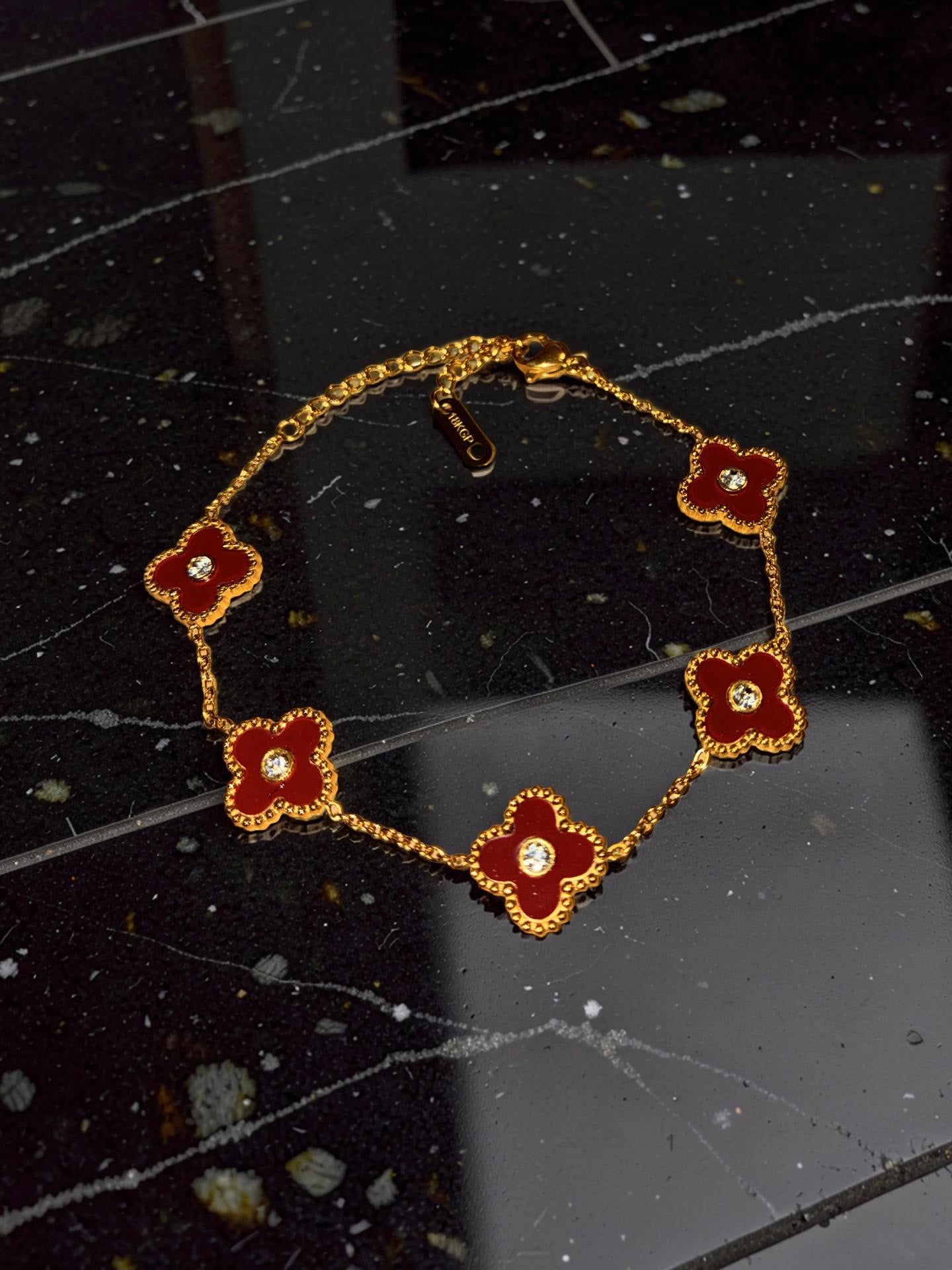 Gold plated, red flowers with rhinestones
