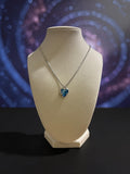 Sterling silver pendant with a blue crystal heart