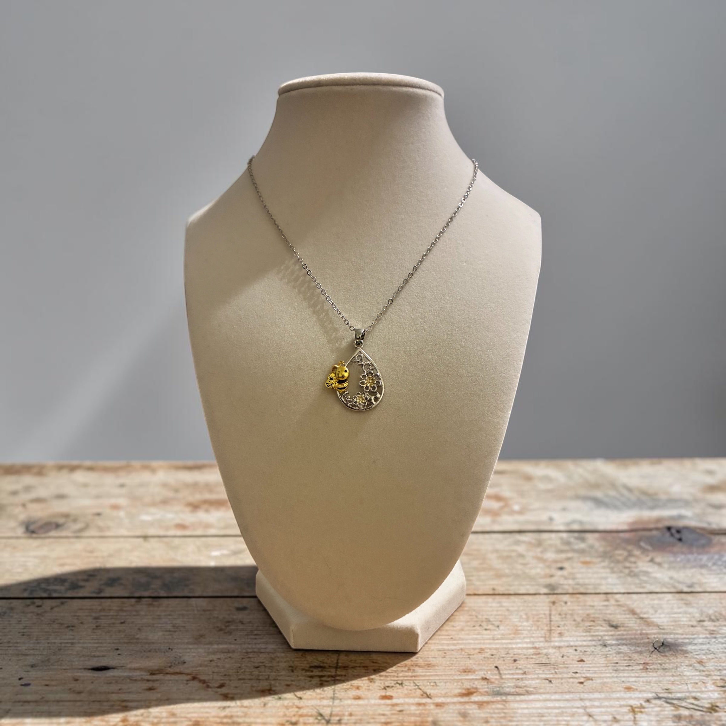Silver plated bee with flowers