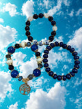 Set of 3 beaded blue bracelets with charm