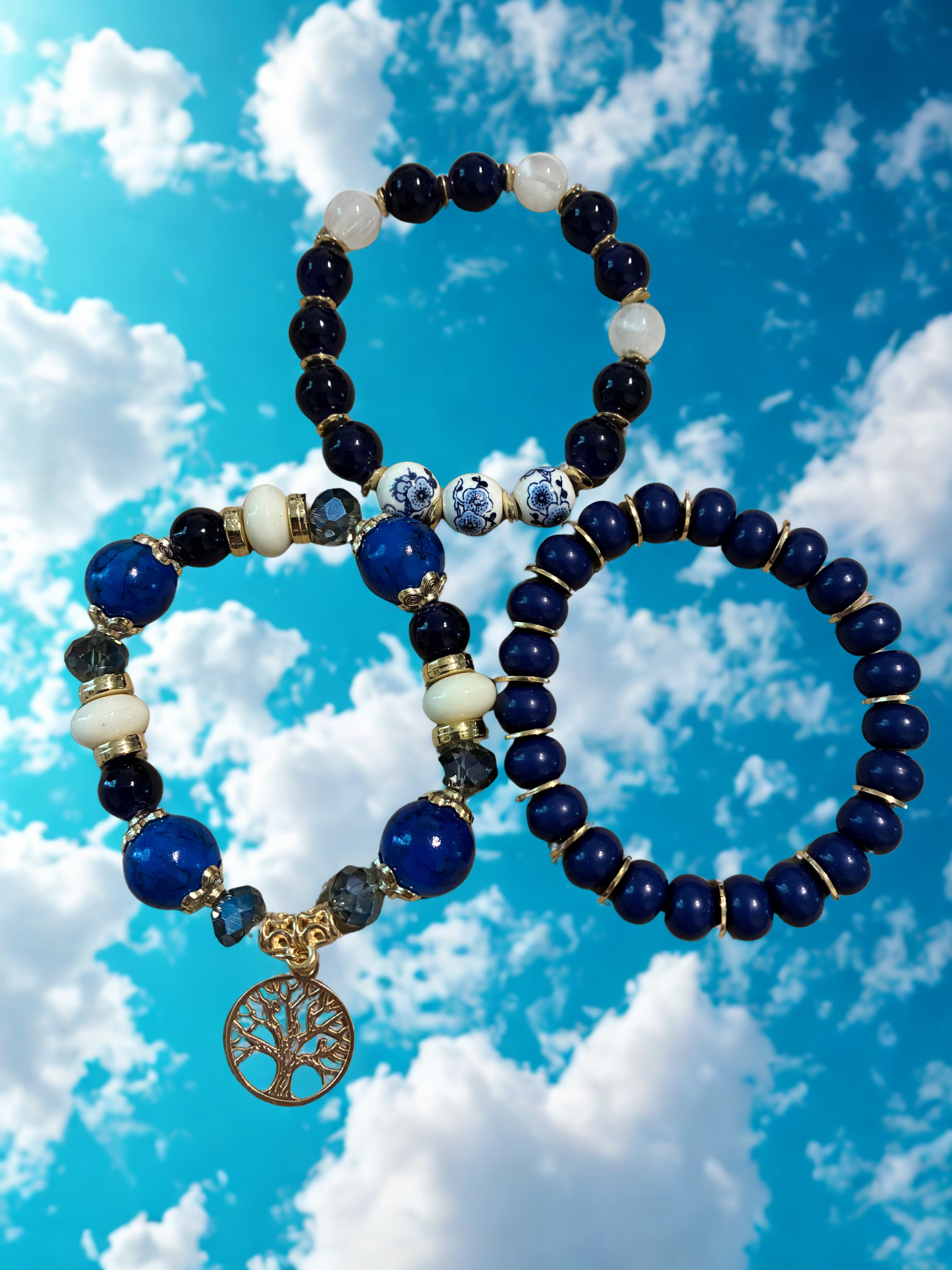 Set of 3 beaded blue bracelets with charm