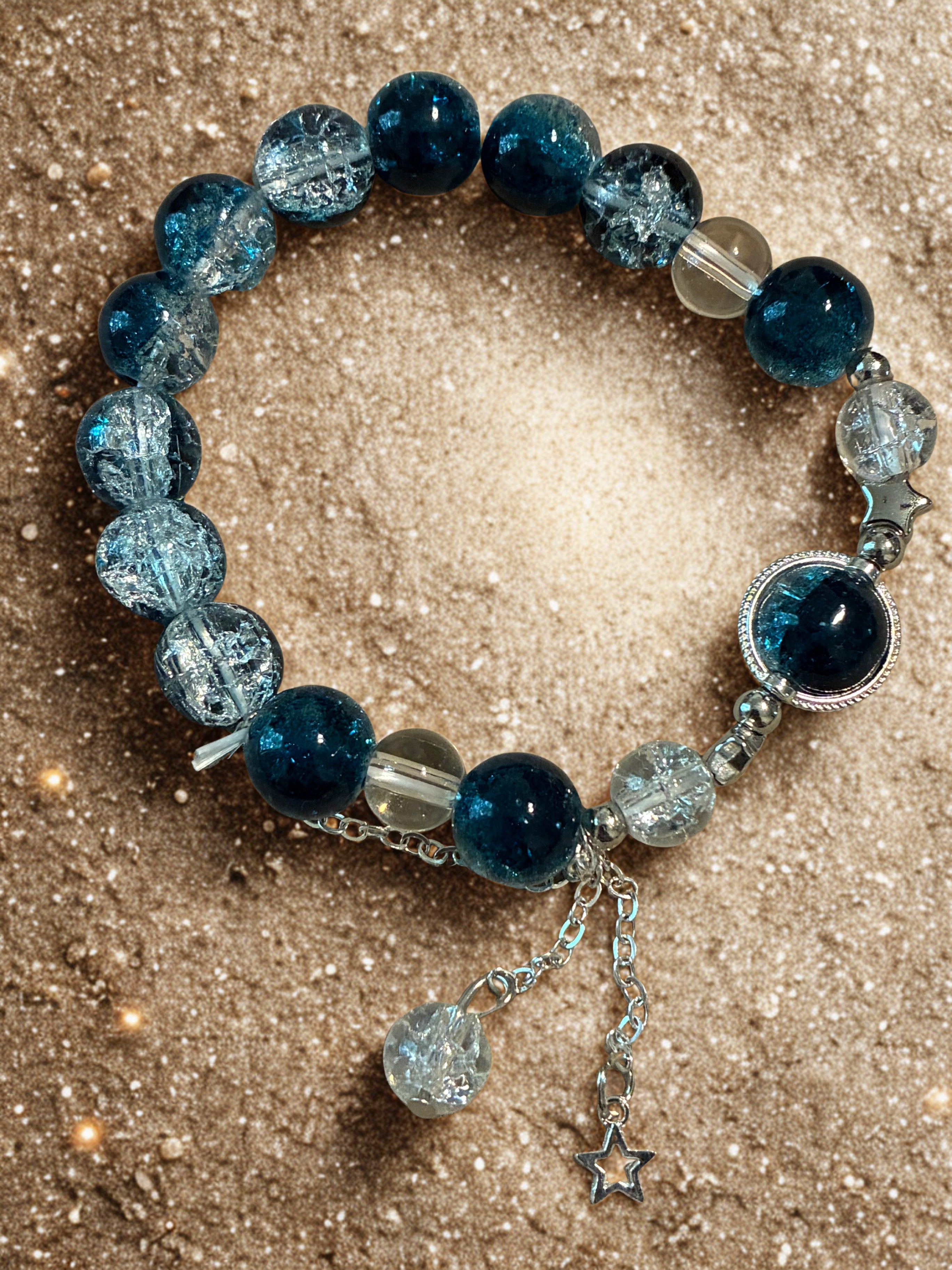 Dark blue galaxy beaded bracelet with charm