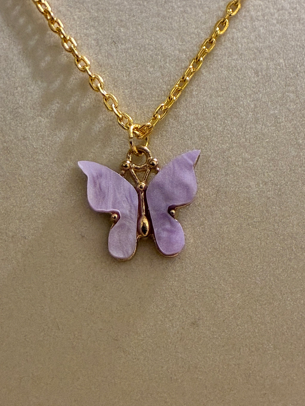 Gold plated lavender butterfly pendant