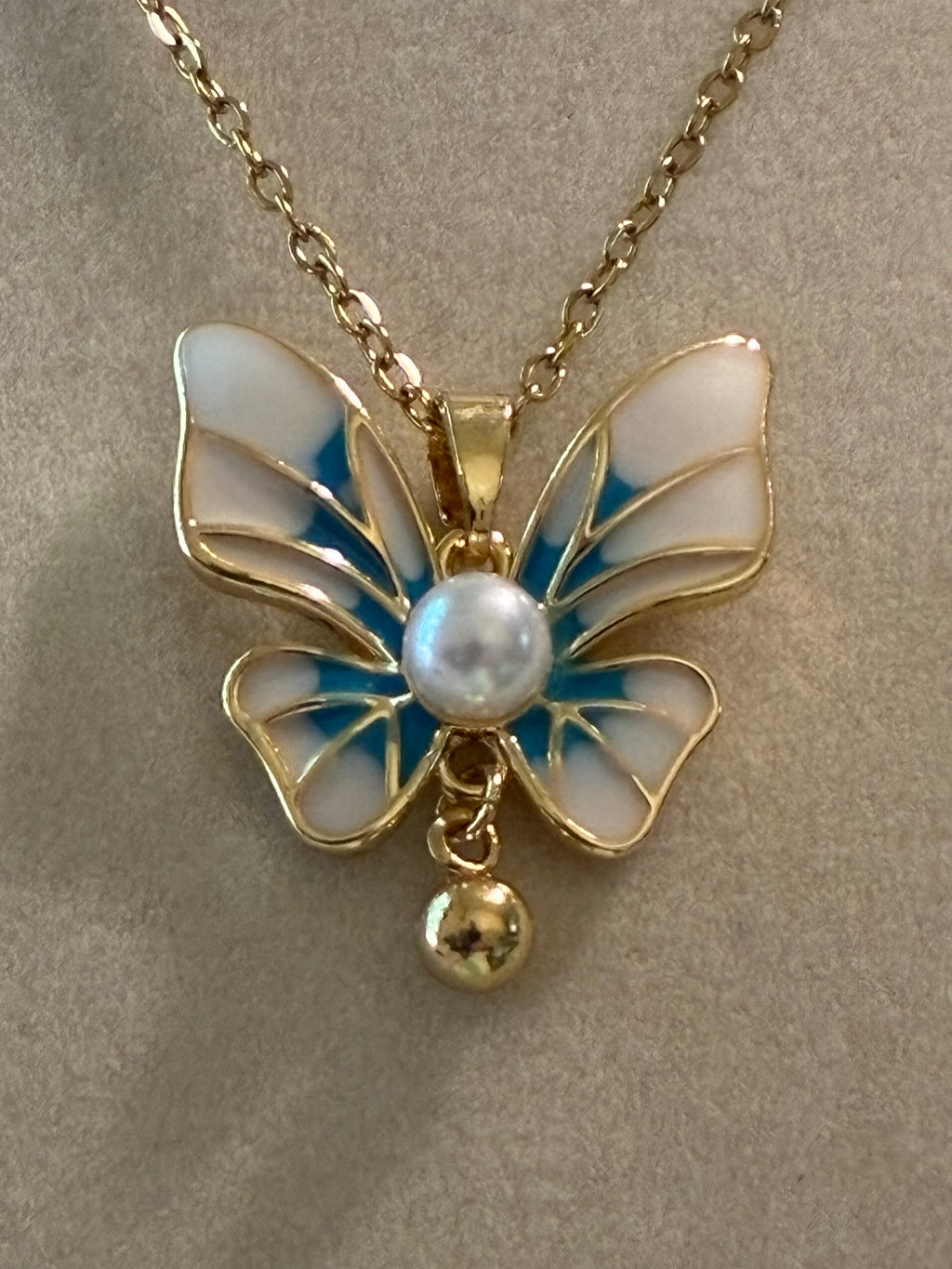 Stainless steel, gold plated, blue and white butterfly with pearl