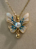Stainless steel, gold plated, blue and white butterfly with pearl