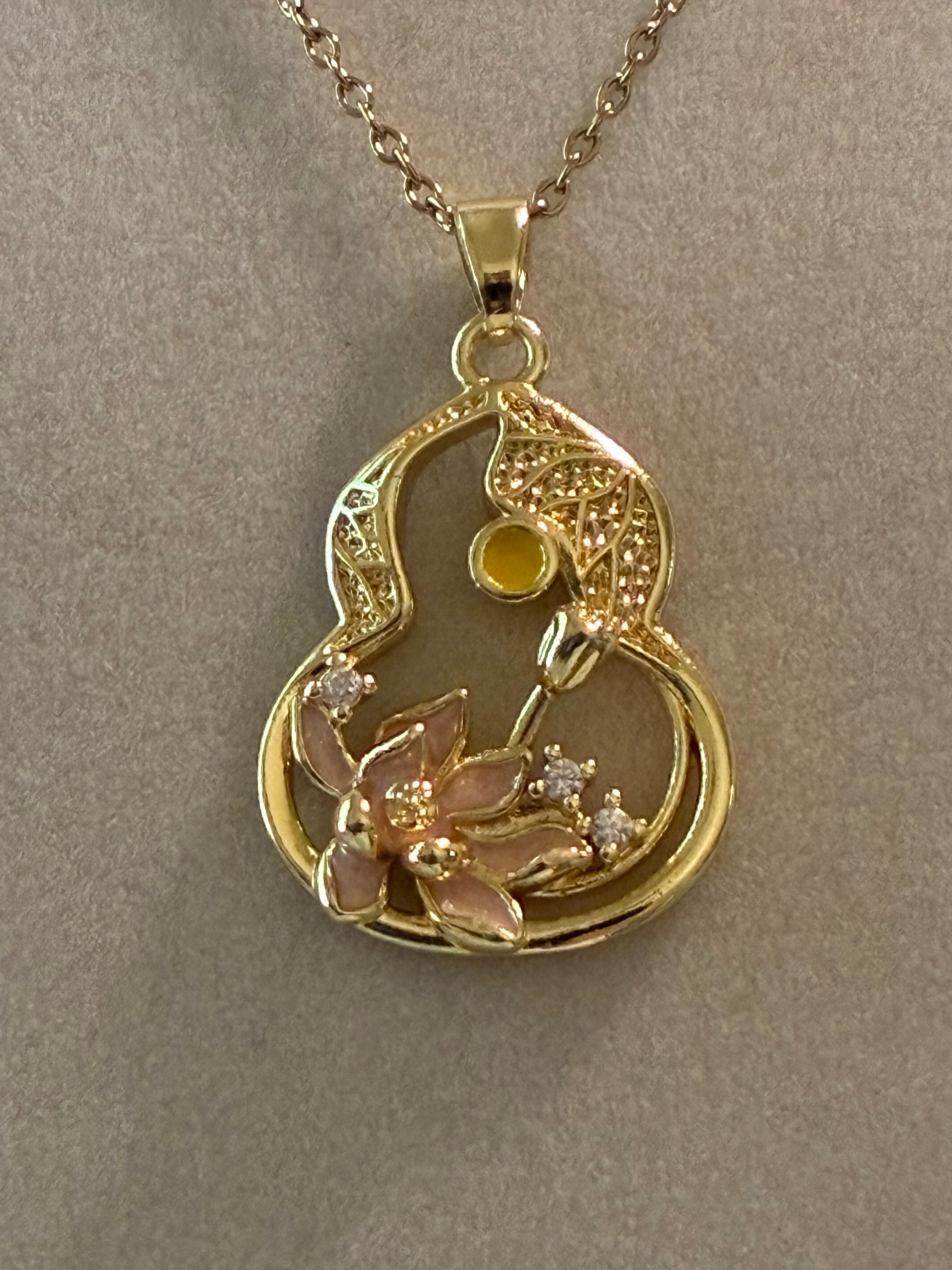 Stainless steel, gold Plated guitar outline with pink flower and rhinestones ￼
